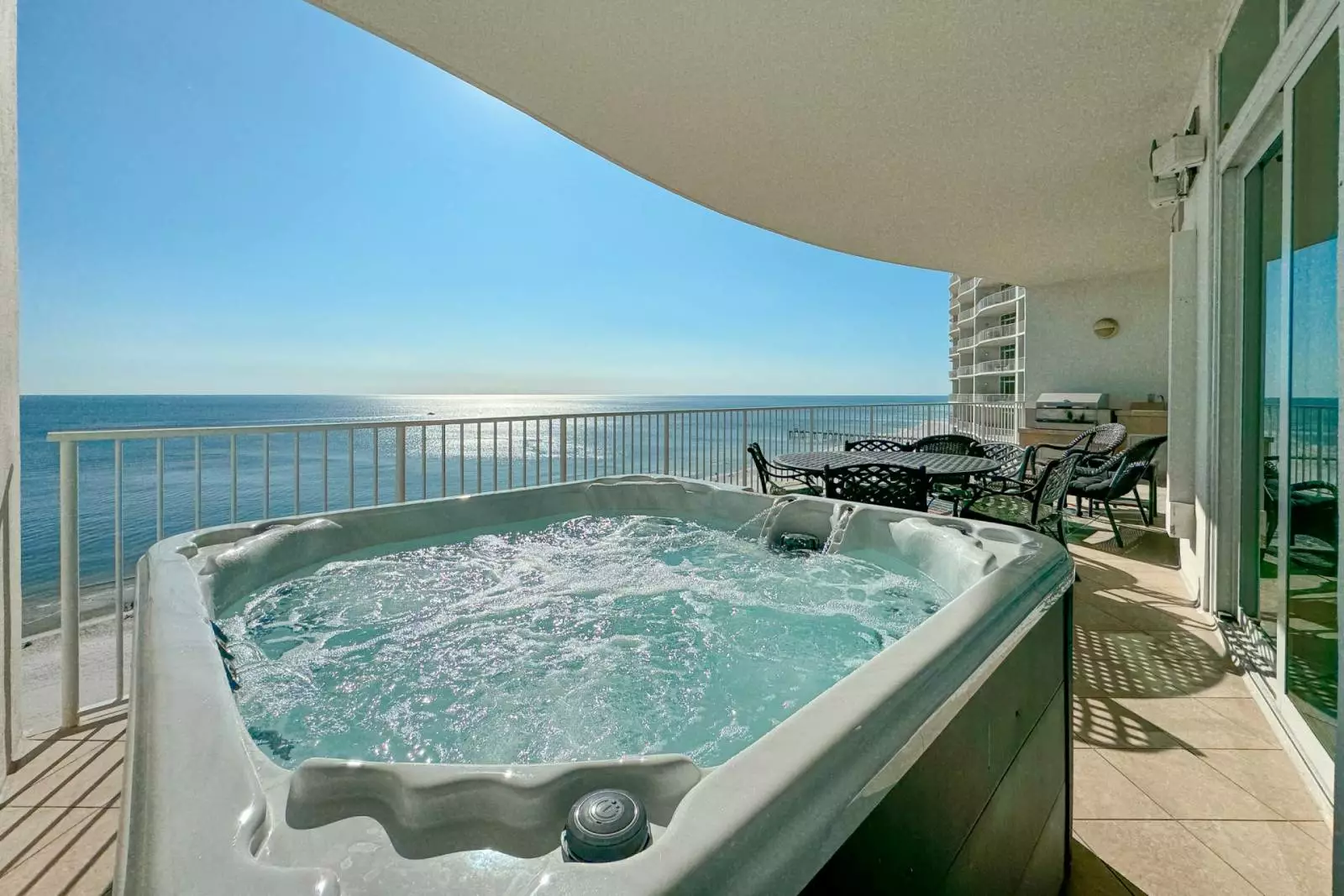 hot tub on balcony facing ocean