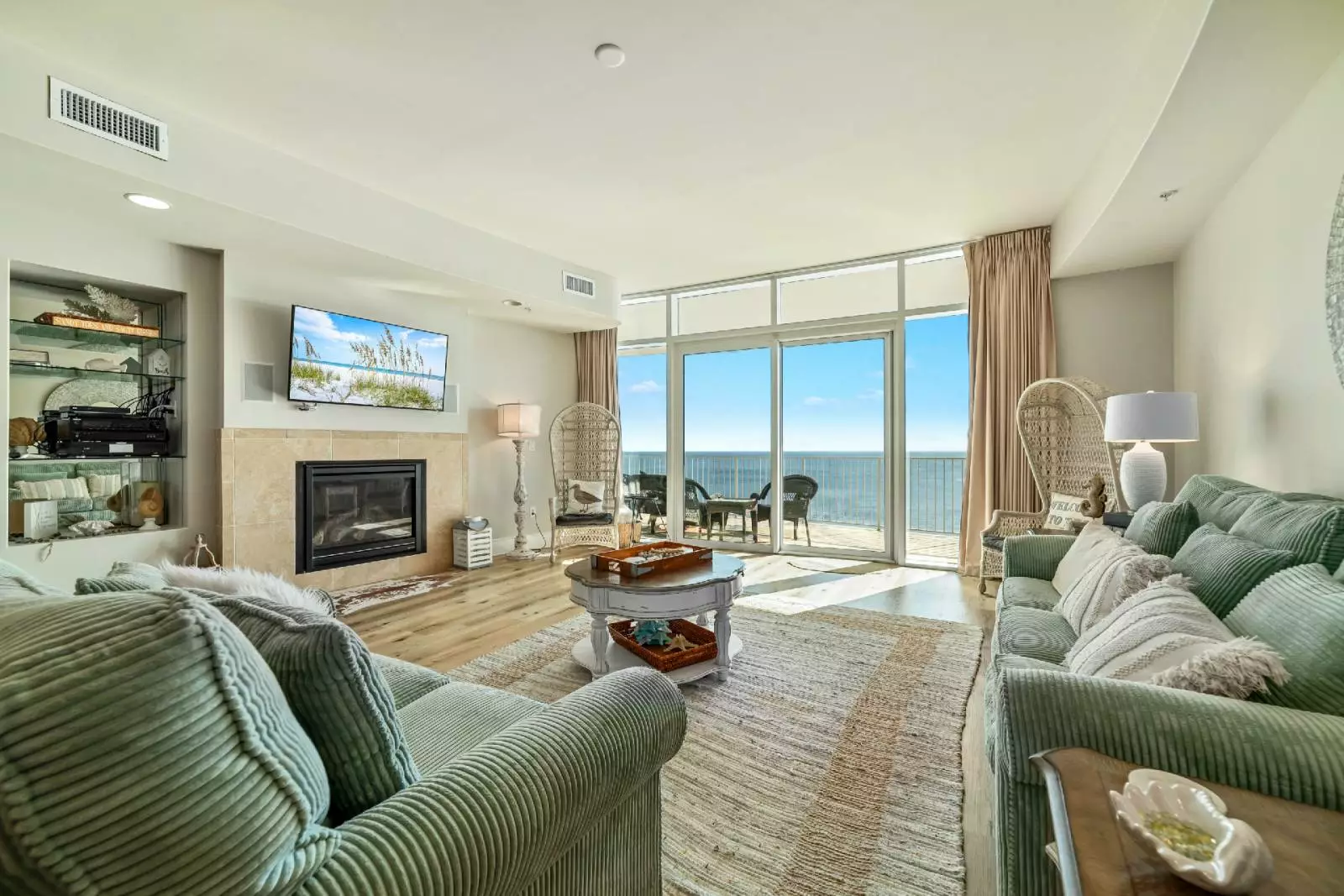 vacation rental living room with fireplace and ocean view
