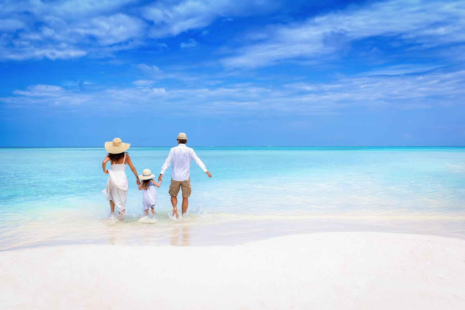 family walking on the beach