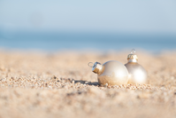 Christmas ornaments in the sand