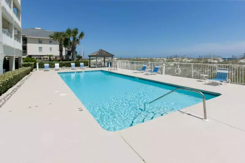 Outdoor pool area with loungers at Casa Del Sol.