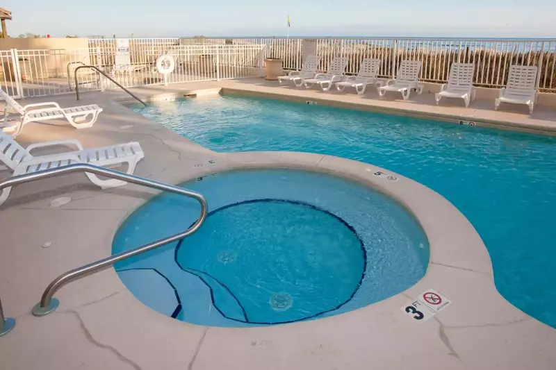 Outdoor pool and hot tub at Four Winds.