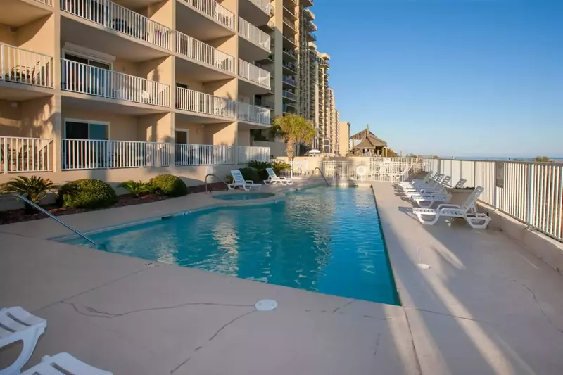 Community pool and hot tub overlooking the beach and the Gulf