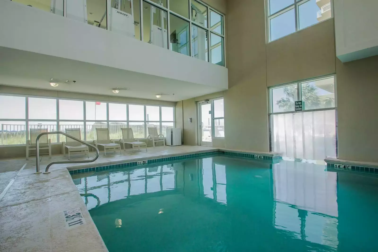 Heated indoor pool with lounge chairs