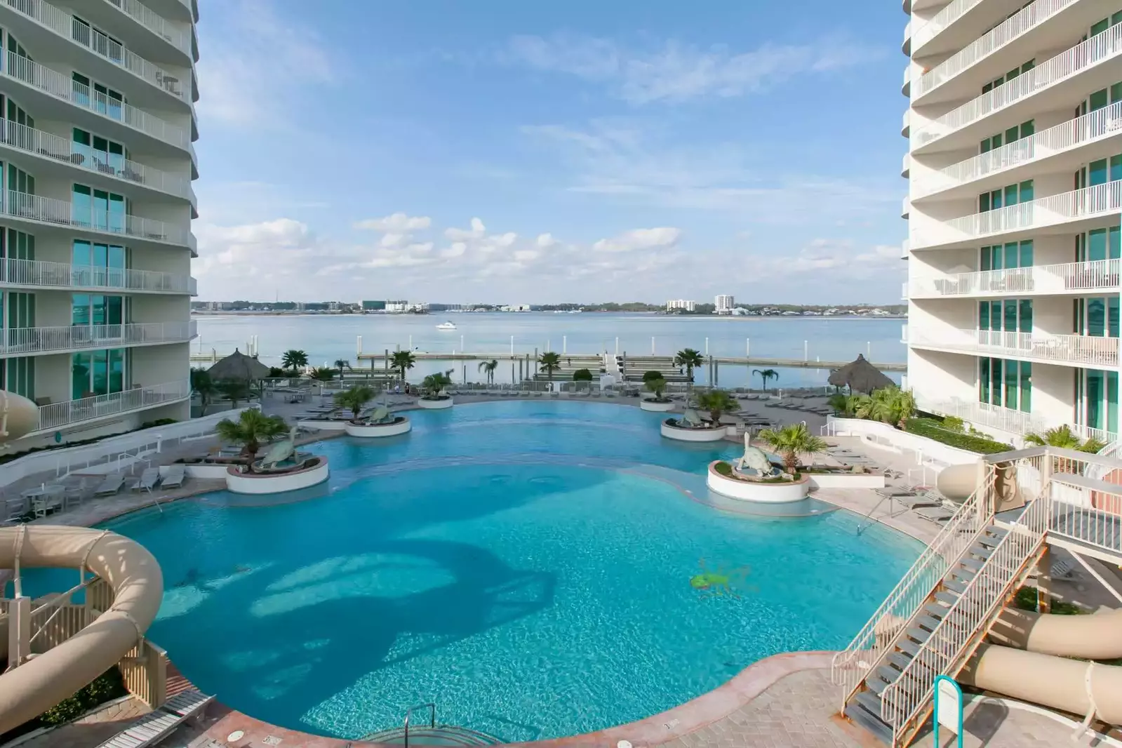 Large tiered pool with views of the bay and marina