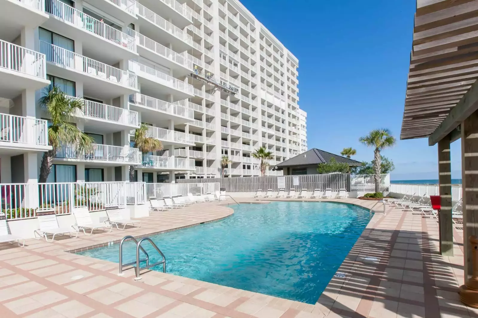 Community pool and lounge chairs