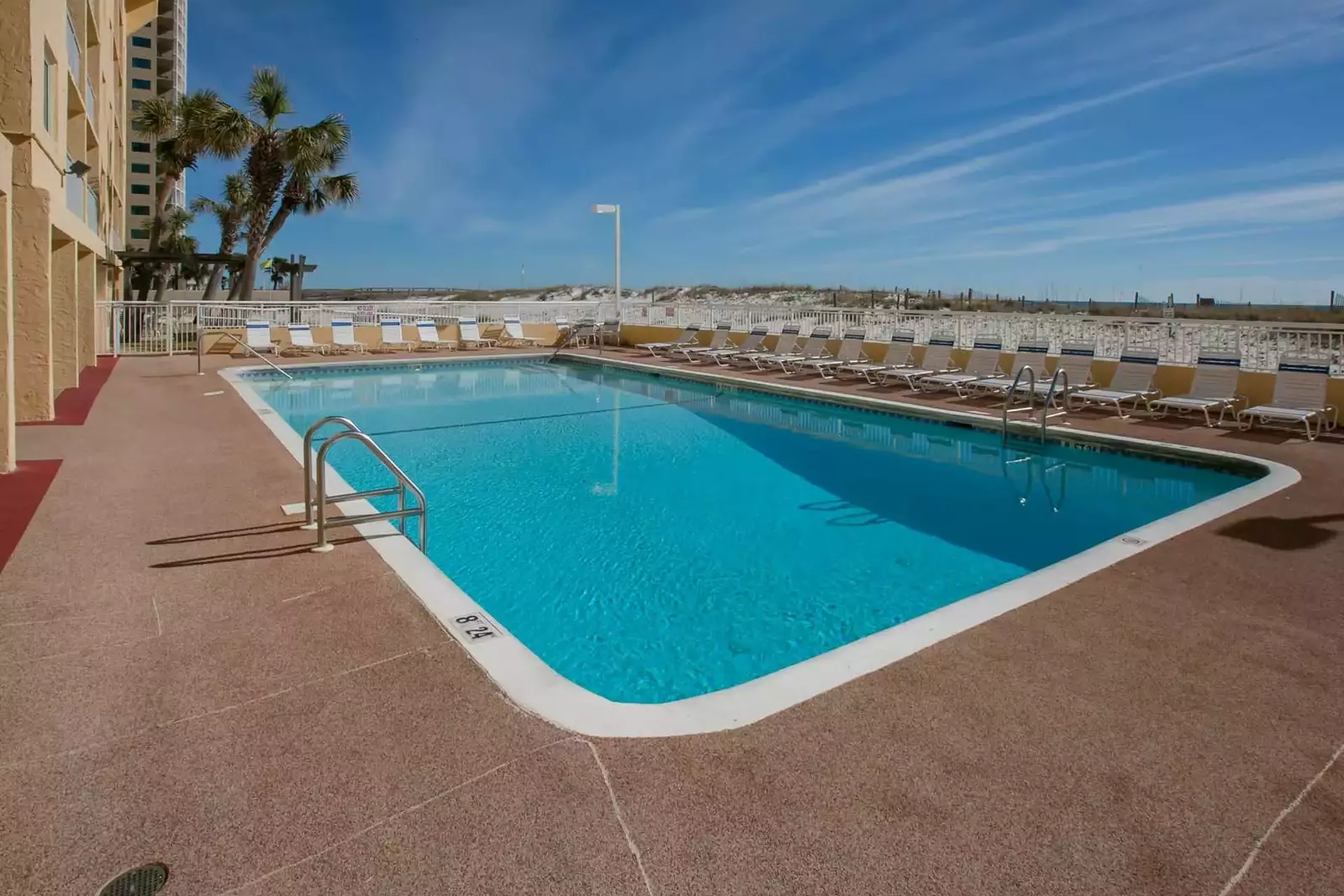 Community pool and lounge chairs.