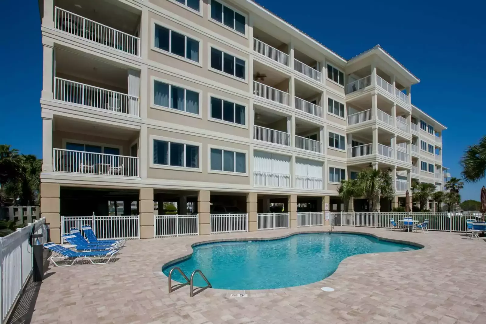 Community pool with lounge and picnic areas