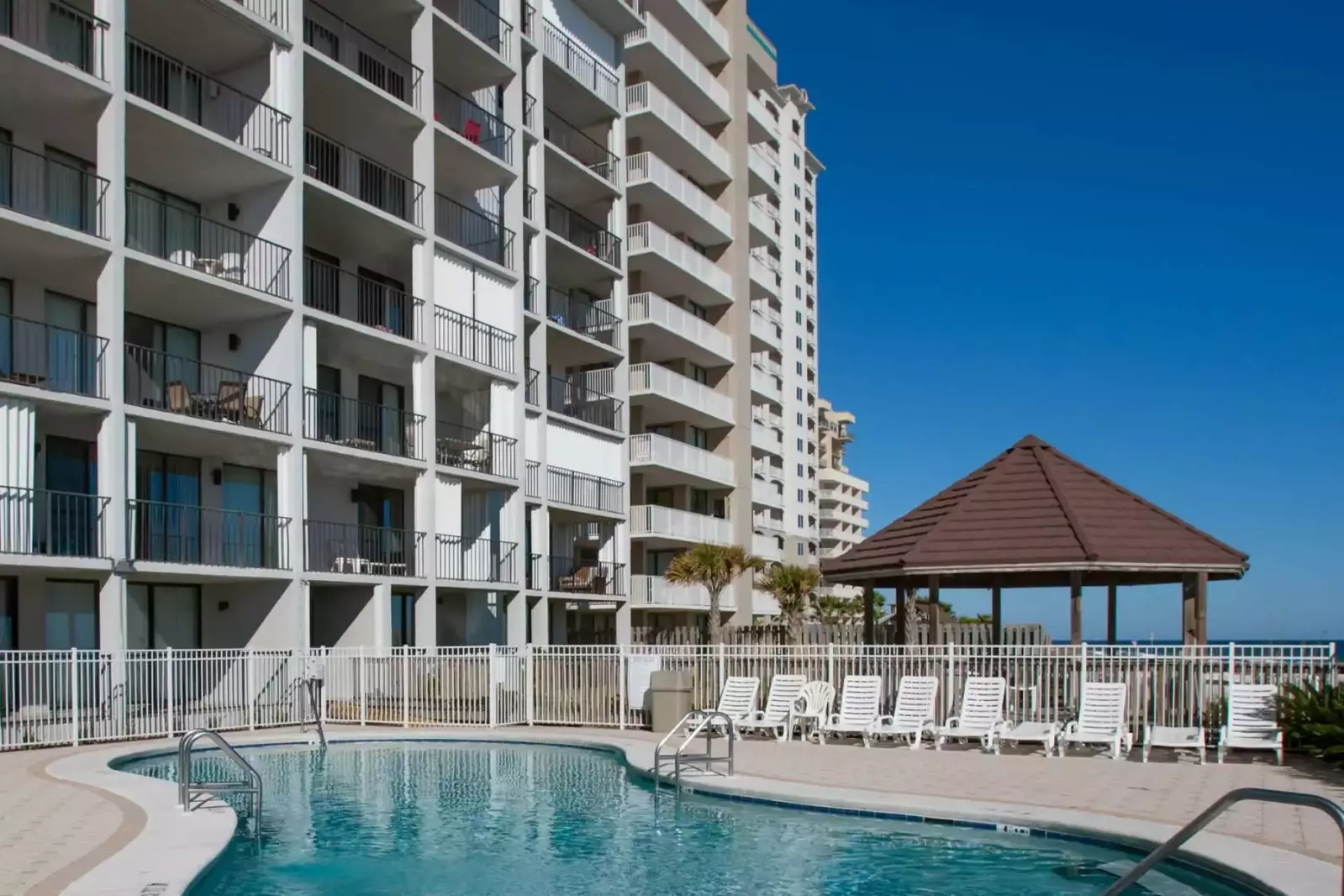 Community pool and lounge chairs