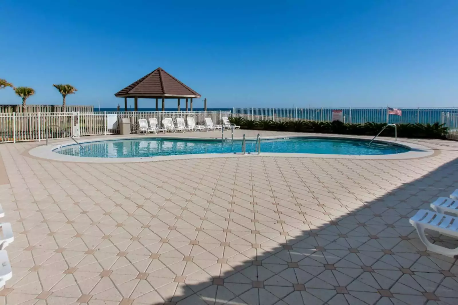 Community pool with background view of Gulf