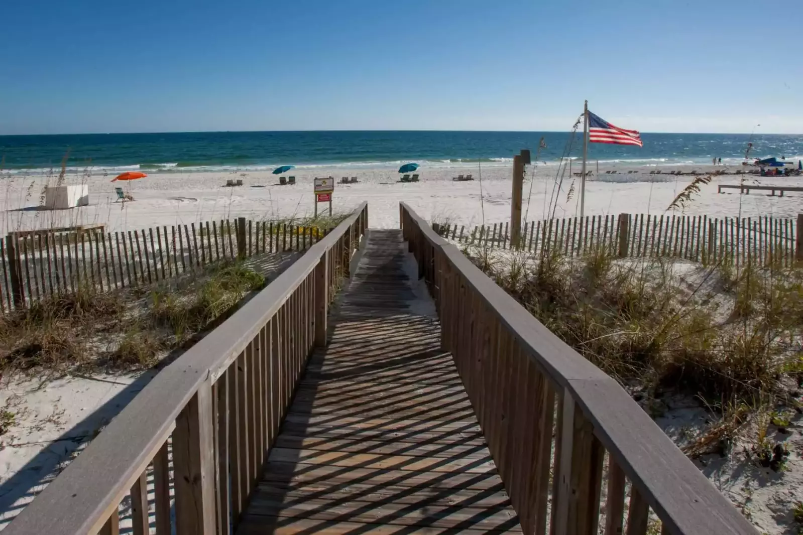 Community boardwalk leading to beach and Gulf