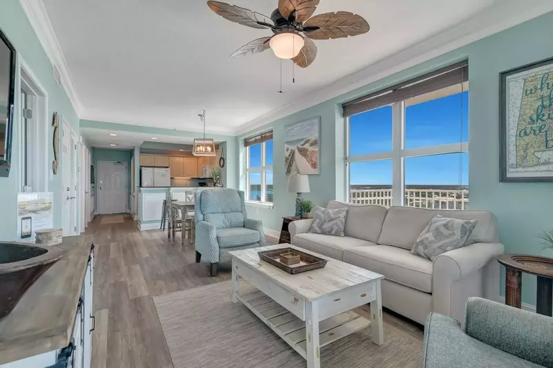 Living area with sofa sleeper, as well as dining for six at the table and breakfast bar.