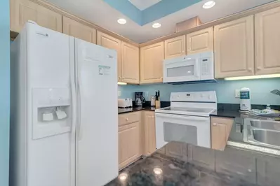 Fully equipped kitchen (with drip coffee pot), stocked with all of the necessities to prepare and serve meals.