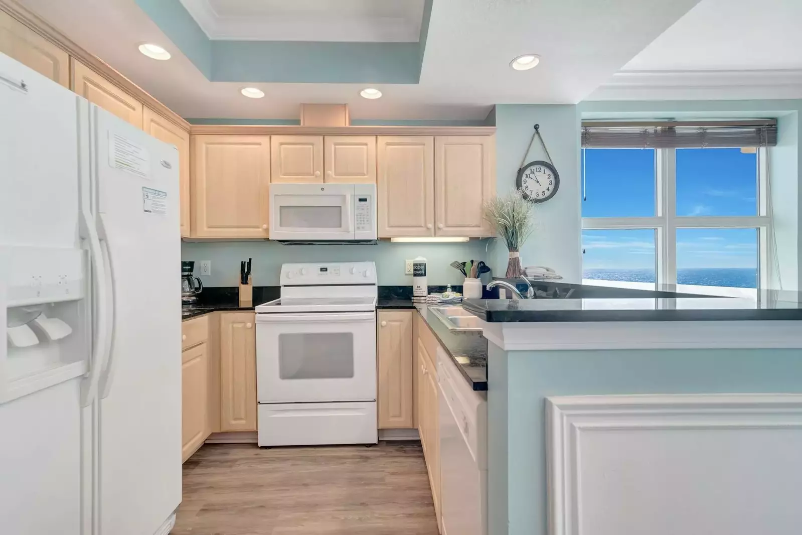 Fully equipped kitchen with plenty of counter space - stocked with all of the necessities to prepare and serve meals.