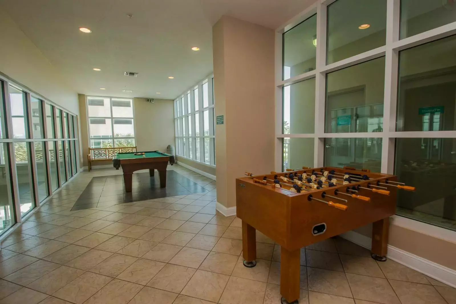 Community game room with pool and foosball tables