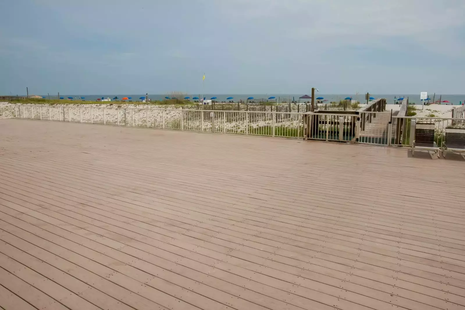 Wide wood deck leading to beach and Gulf