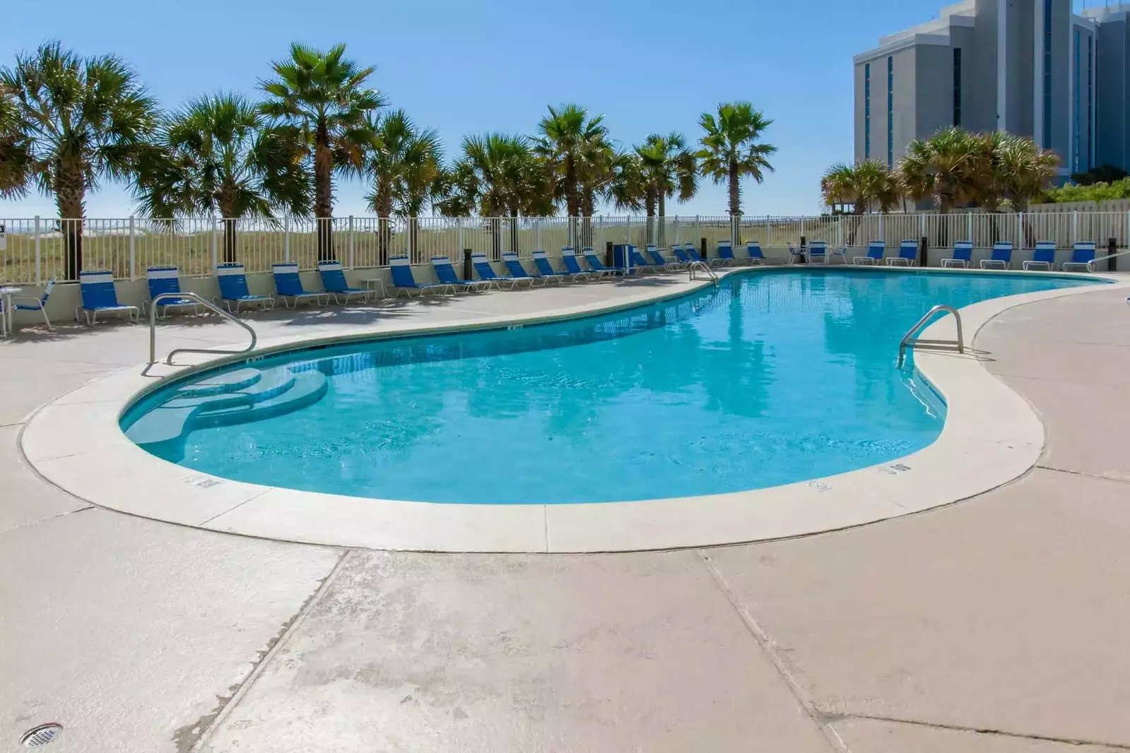 Community pool and lounge chairs