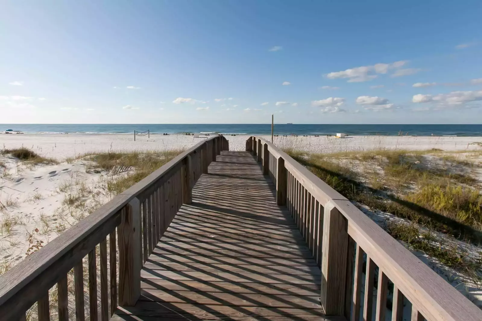 Community boardwalk leading to beach and Gulf