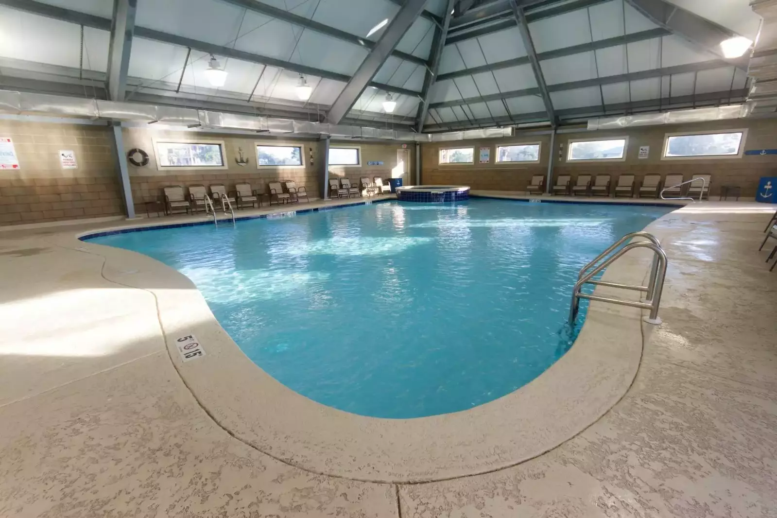 Indoor pool with lounge chairs