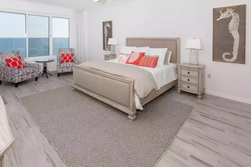 Primary bedroom with king bed, seating for 2 and beautiful Gulf views