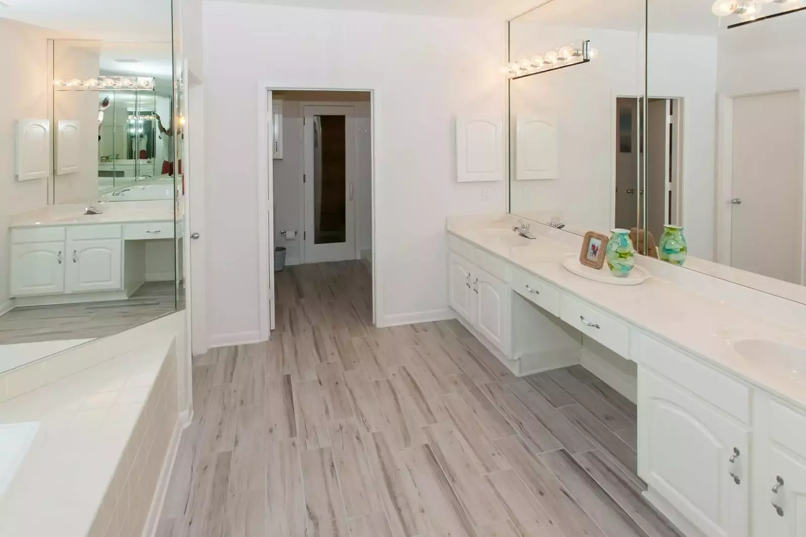 Primary bath with Jacuzzi, dual vanities, sauna and walk-in shower