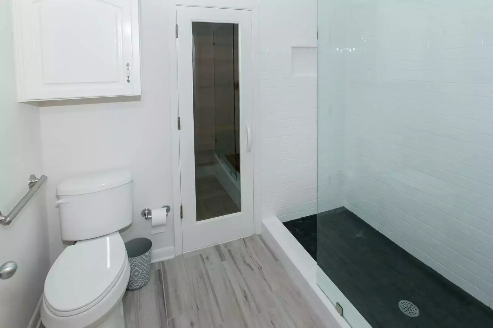 Primary bath with commode and walk in shower