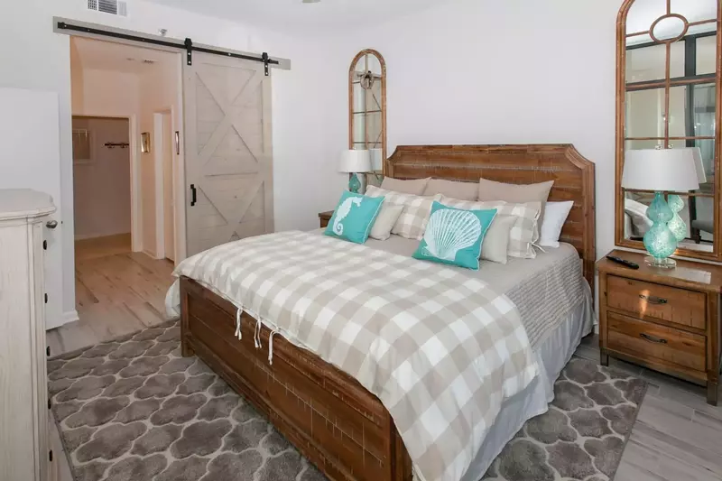 Guest room with king bed and barn door