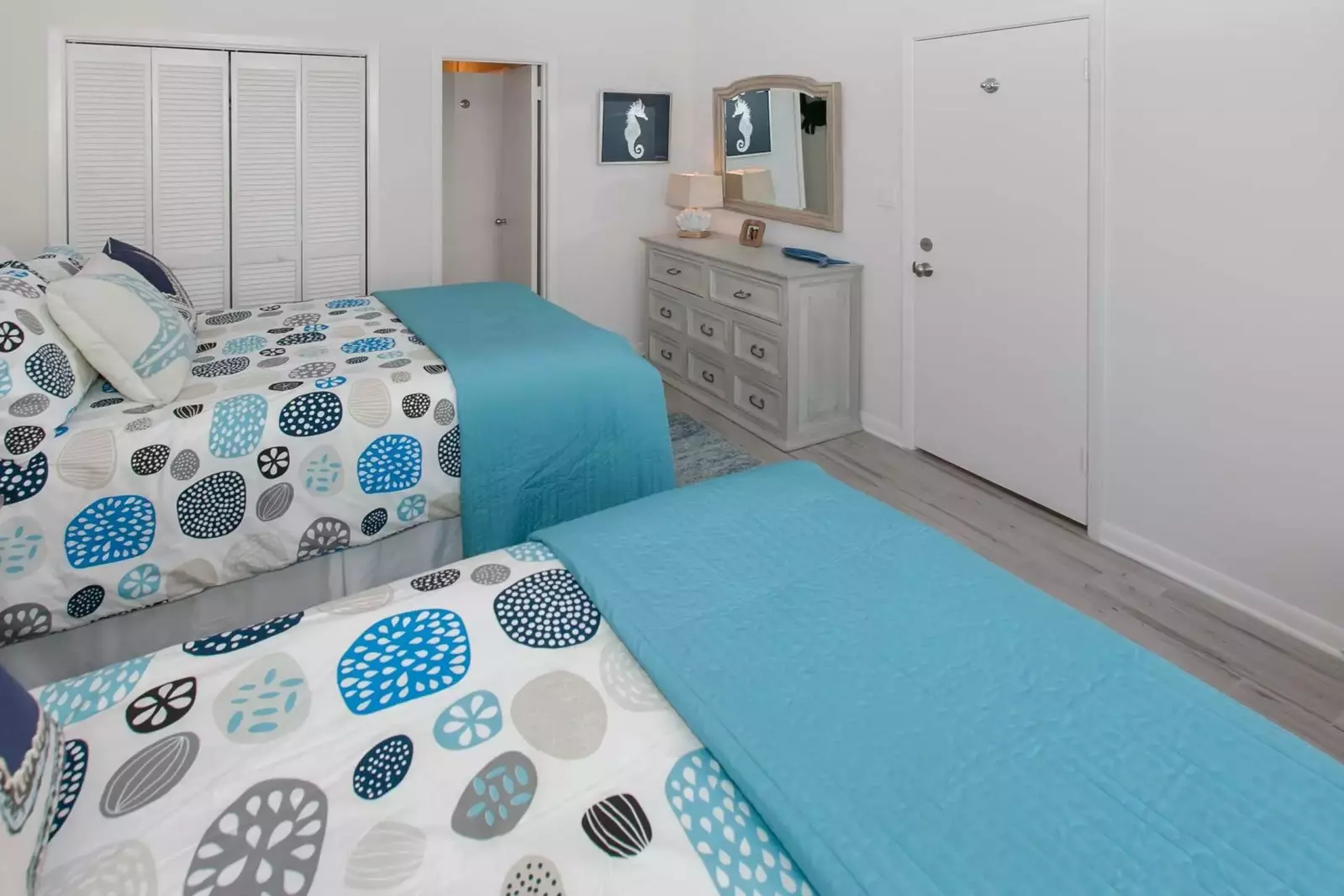 Guest room with triple dresser and double closet