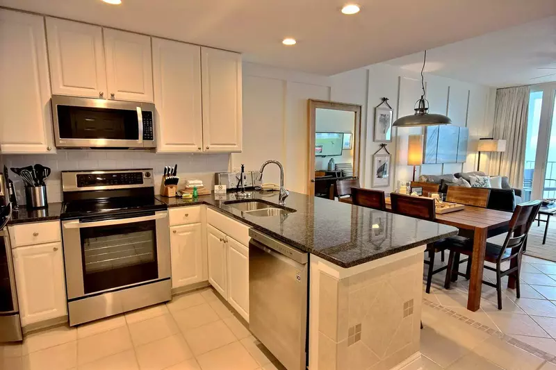 Kitchen with recessed lighting, granite counters and subway tile backsplash