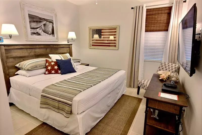 Guest bedroom with king bed and two reading lamps