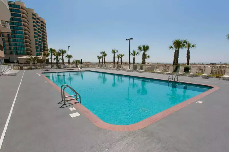 Community pool with lounge chairs
