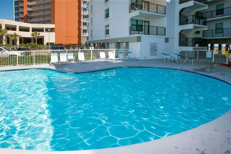 Community pool with lounge chairs