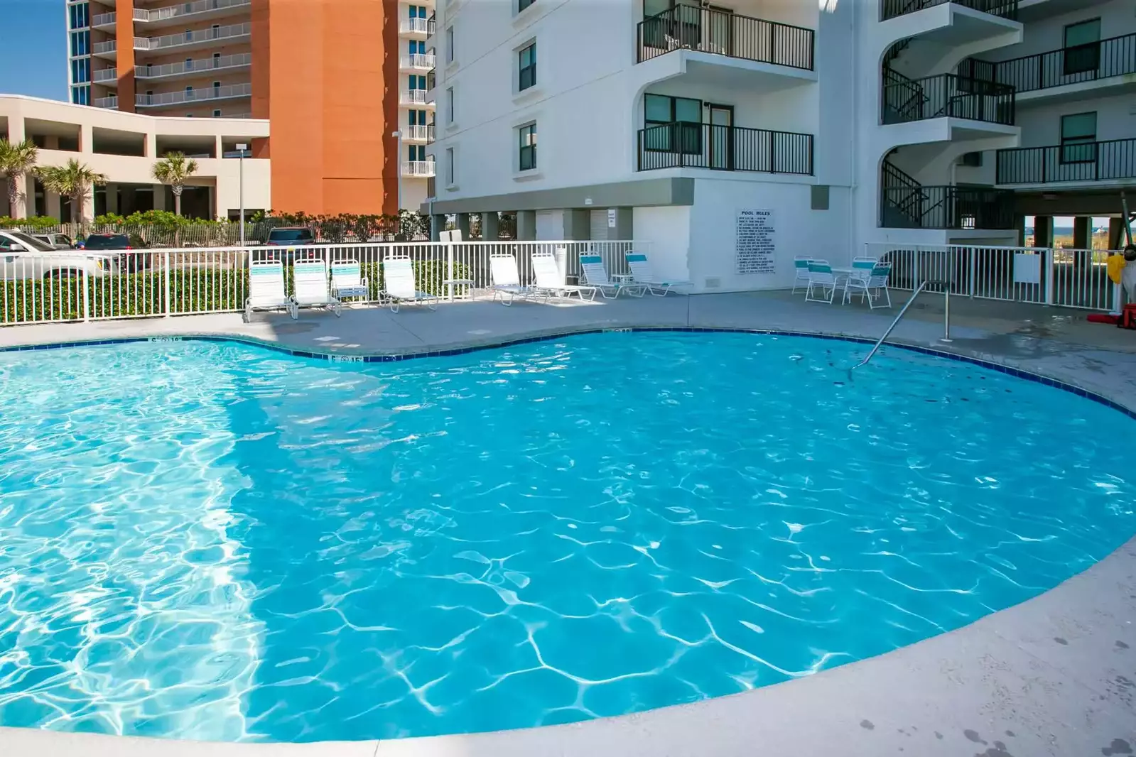 Community pool with lounge chairs