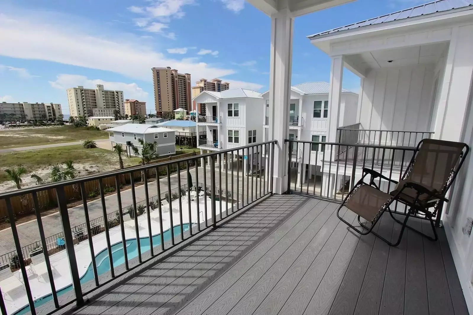 View of beach, pool and community
