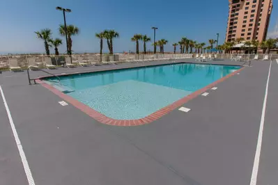 Community pool with lounge chairs