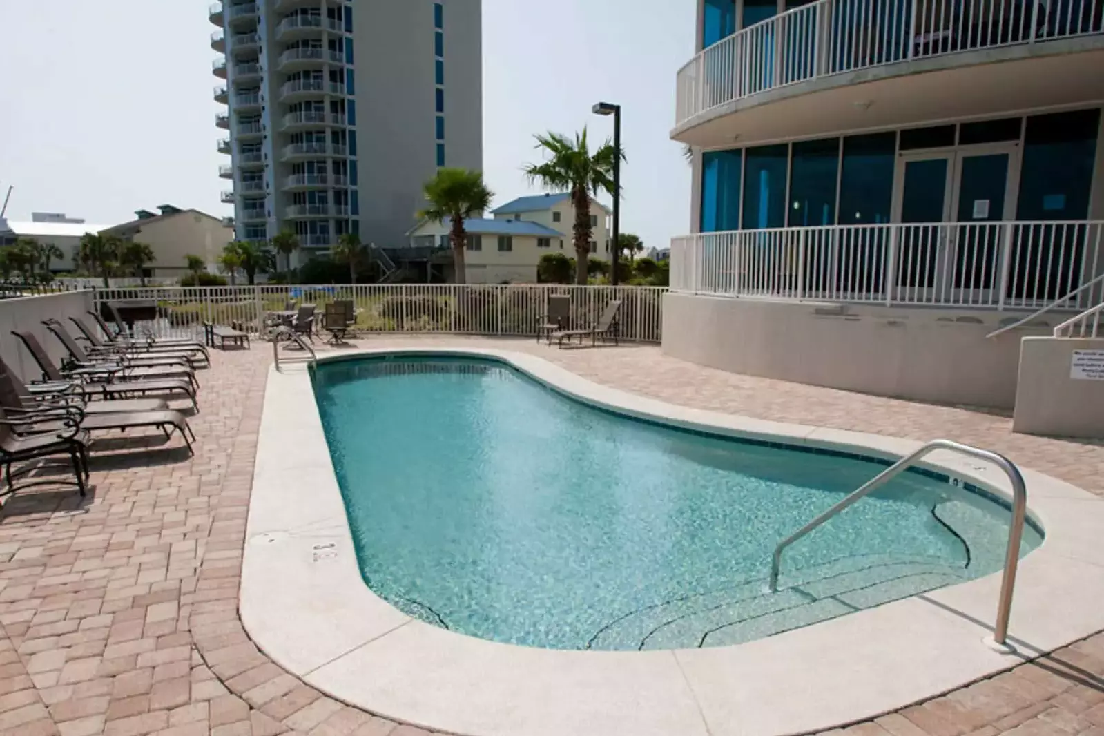 Community pool and lounge chairs