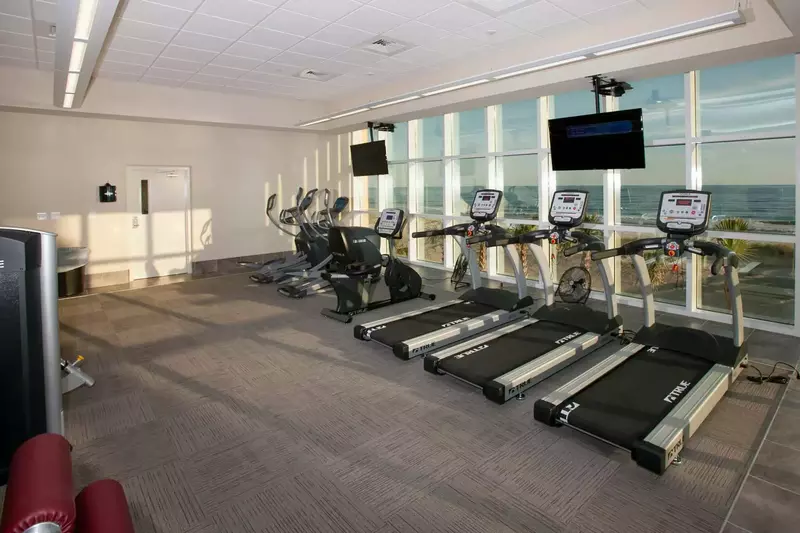 Cardio equipment overlooking the beach and Gulf