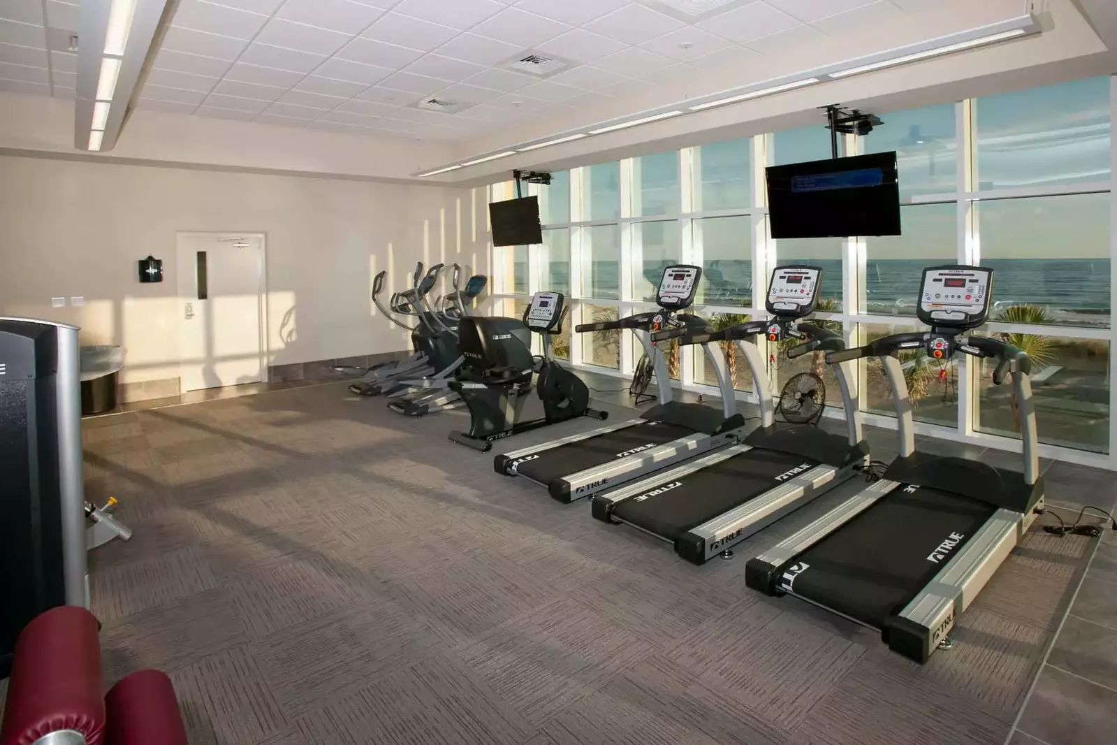 Cardio equipment overlooking the beach and Gulf