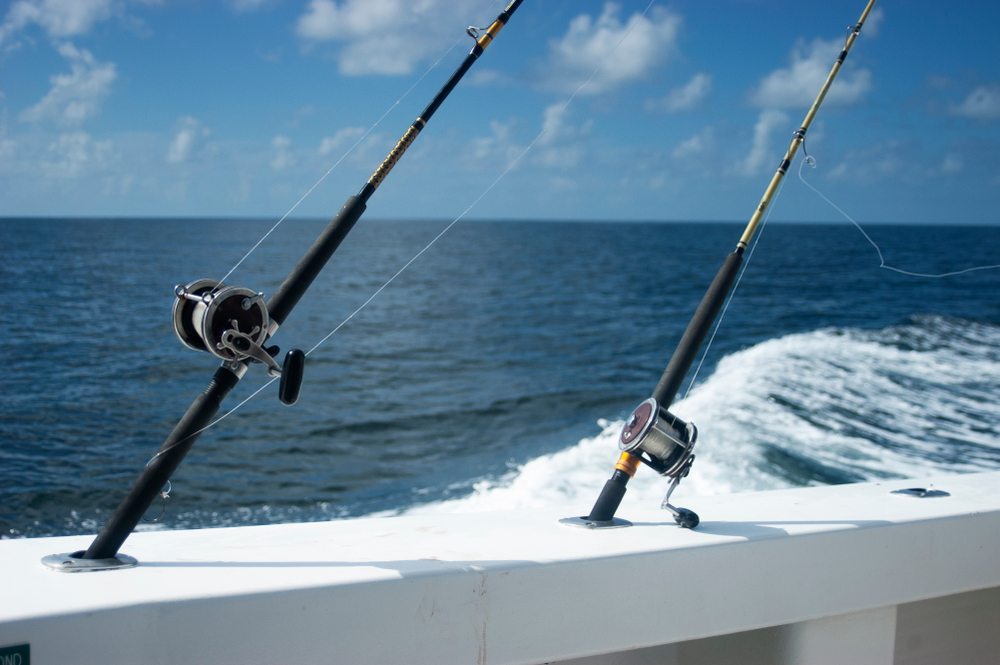 fishing rods on side of boat