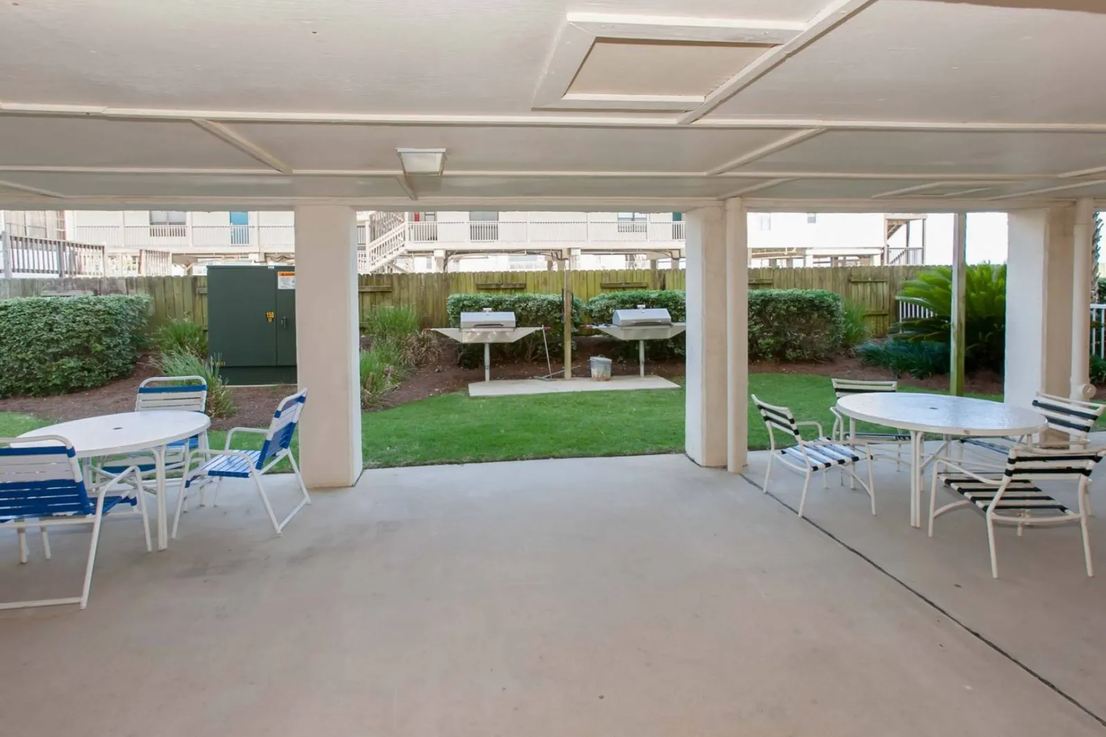 Covered picnic area by the grills.