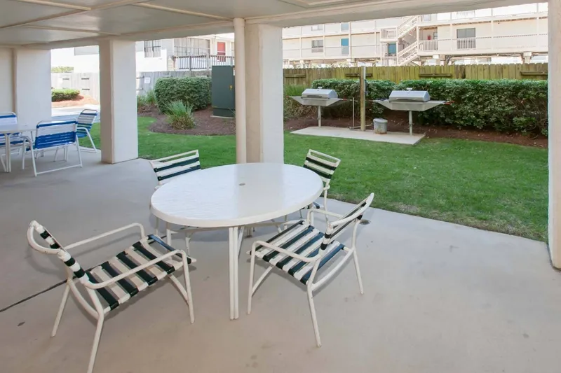Covered picnic area by the grills.