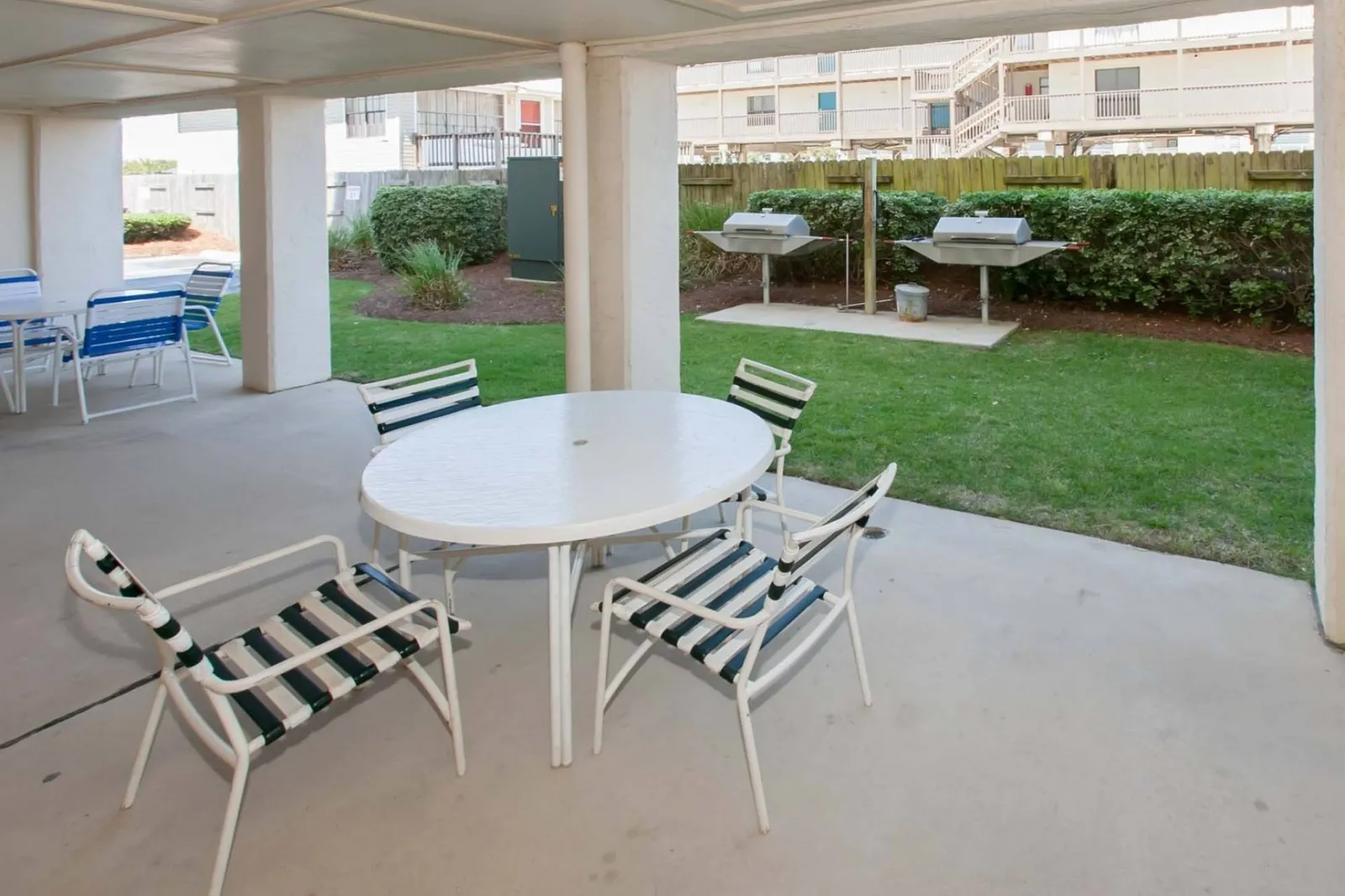 Covered picnic area by the grills.